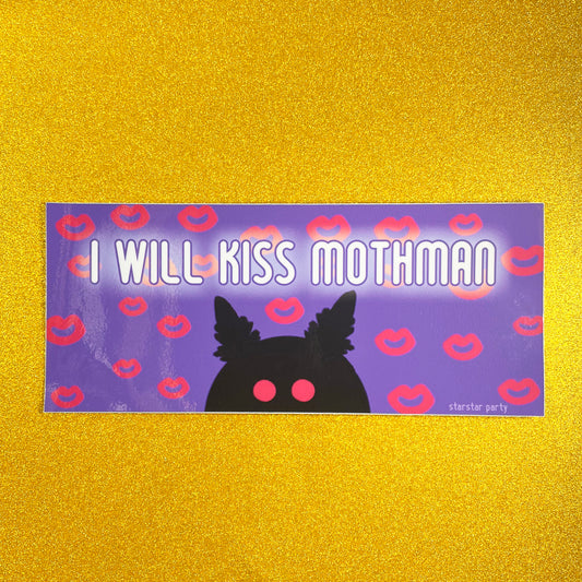 A bumper sticker sits on a sparkly gold background. The bumper sticker features a purple background with hot pink kiss marks all over it. In the center bottom of the sticker is a black silhouette of mothman with hot pink eyes. The text on the sticker reads, "I will kiss Mothman".