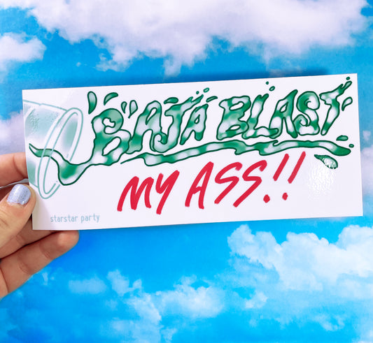 A hand holds a bumper sticker in front of a sky-print background. The sticker has a cup tipping over, with hand-drawn text that looks like green translucent liquid falling out. It reads, "Baja Blast My Ass".